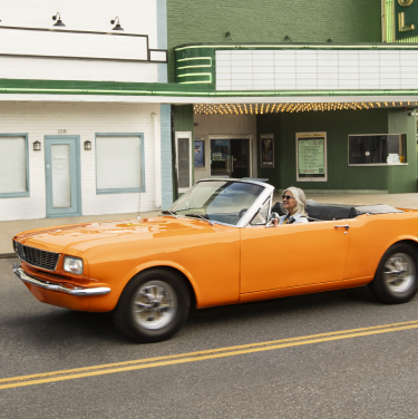 Orange convertible in an intersection